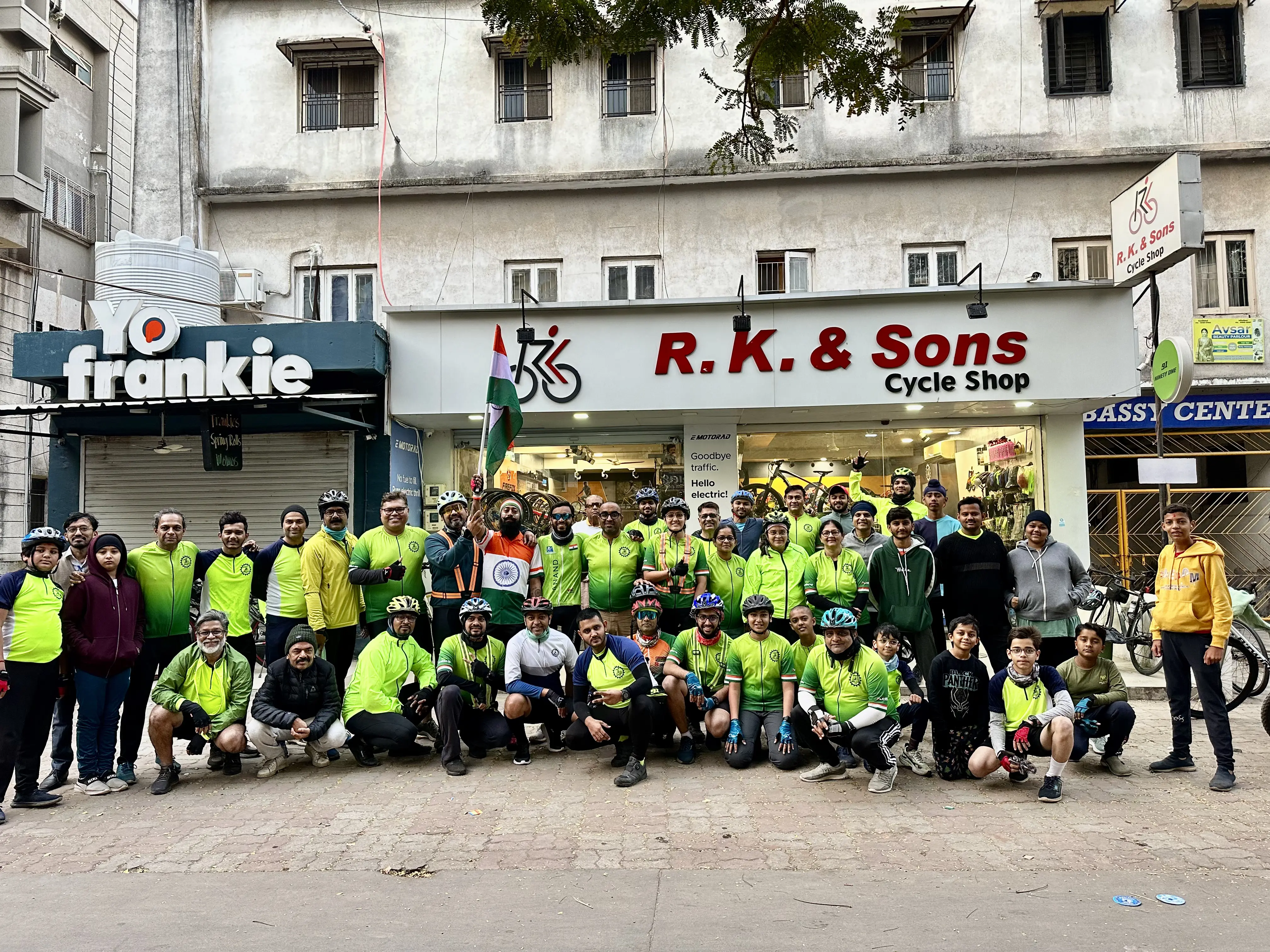 Official group photograph of The Anand Cycling Club outside R. K. & Sons